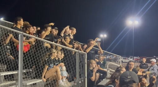 Students celebrating in bleachers